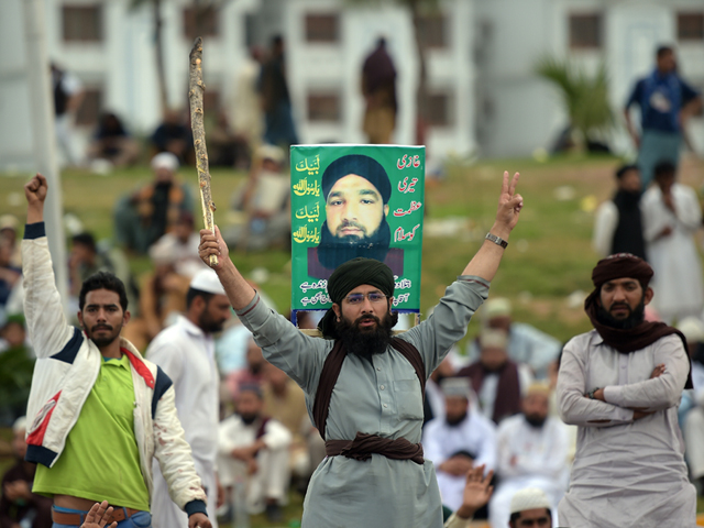 supporters of executed islamist mumtaz qadri shout slogans during an anti government protest in front of the parliament building in islamabad on march 28 2016 photo afp