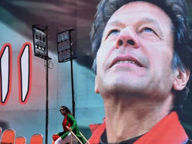 supporters of pakistani politician and former cricketer imran khan stand next to electoral poster of khan at the venue of an election campaign meeting by khan 039 s party pakistan tehreek e insaf pti in islamabad on may 9 2013 photo afp supporters of pakistani politician and former cricketer imran khan stand next to electoral poster of khan at the venue of an election campaign meeting by khan 039 s party pakistan tehreek e insaf pti in islamabad on may 9 2013 photo afp