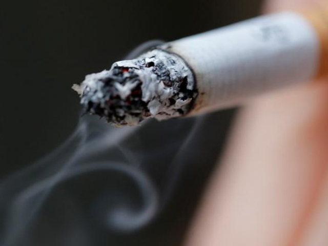 a woman smokes a cigarette in this illustration picture taken in paris october 8 2014 photo reuters