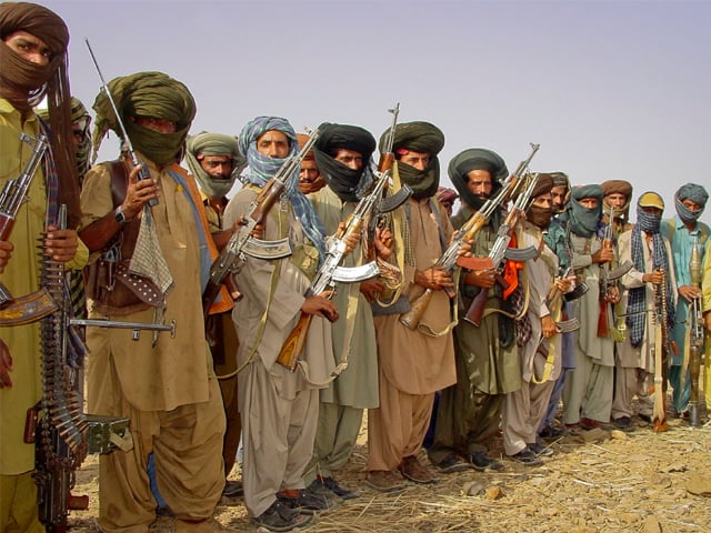 baloch rebels holding their weapons as they pose for a photograph at an undisclosed location in balochistan photo reuters