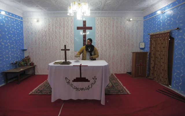 a pakistani altar boy tidies up the communion table at a church in south waziristan november 28 2012 photo reuters a pakistani altar boy tidies up the communion table at a church in south waziristan november 28 2012 photo reuters
