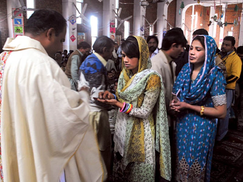 christians attend a ceremony at st michael catholic church in peshawar on tuesday photo muhammad iqbal express