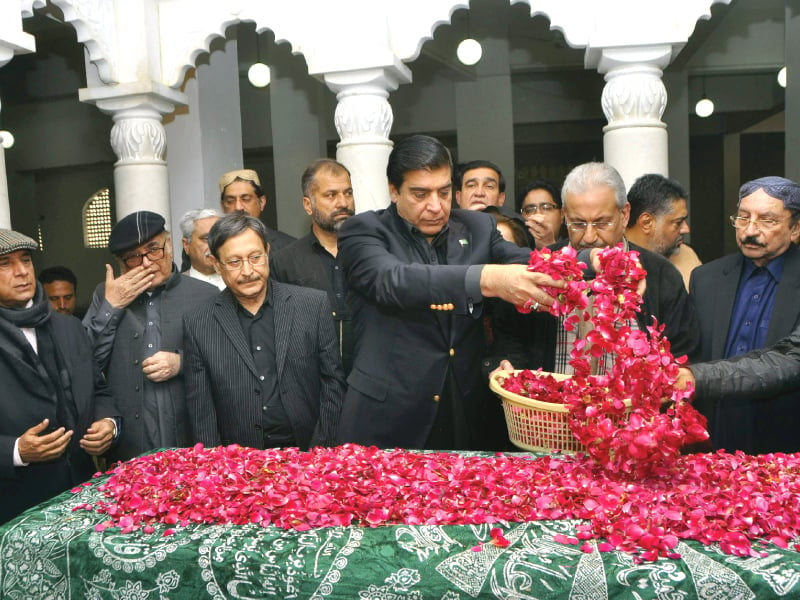 prime minister raja pervaiz ashraf lays flowers over benazir bhutto s grave photo reuters