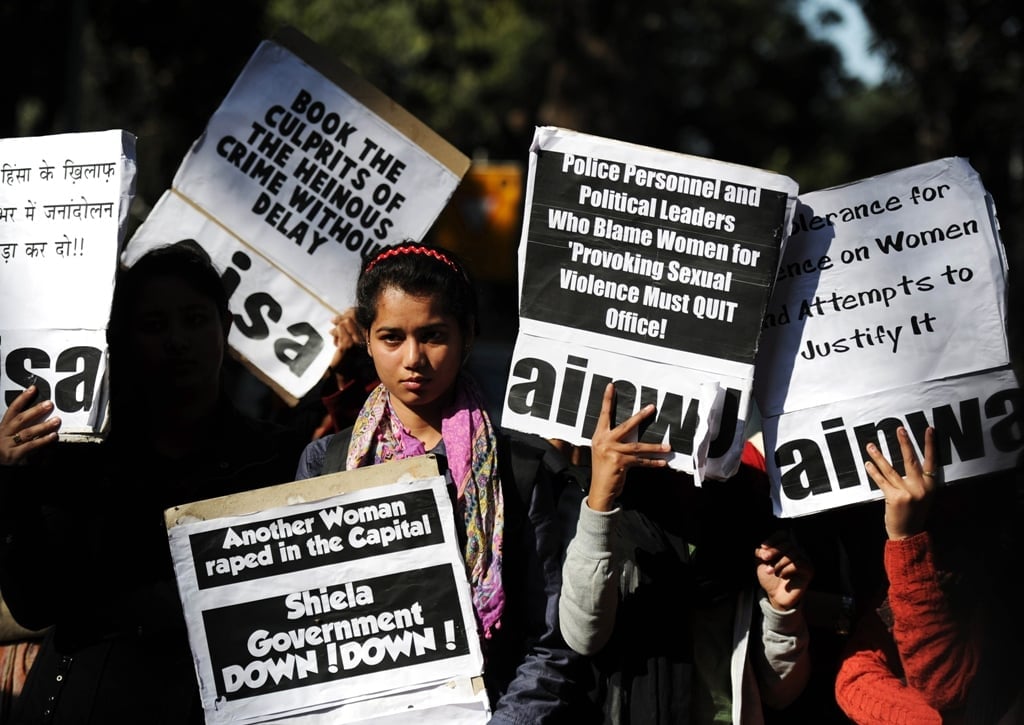 in this photograph taken on december 16 2012 indian activists listen to a speech outside delhi 039 s chief minister residence during a protest in new delhi following the gang rape of a student on december 16 photo afp