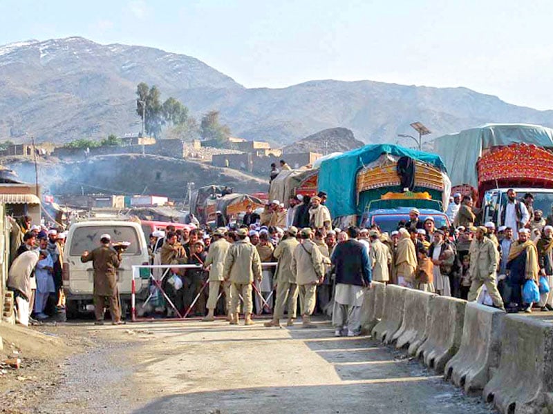 vehicles lined up at the torkham border waiting to traverse to the other side photo sana