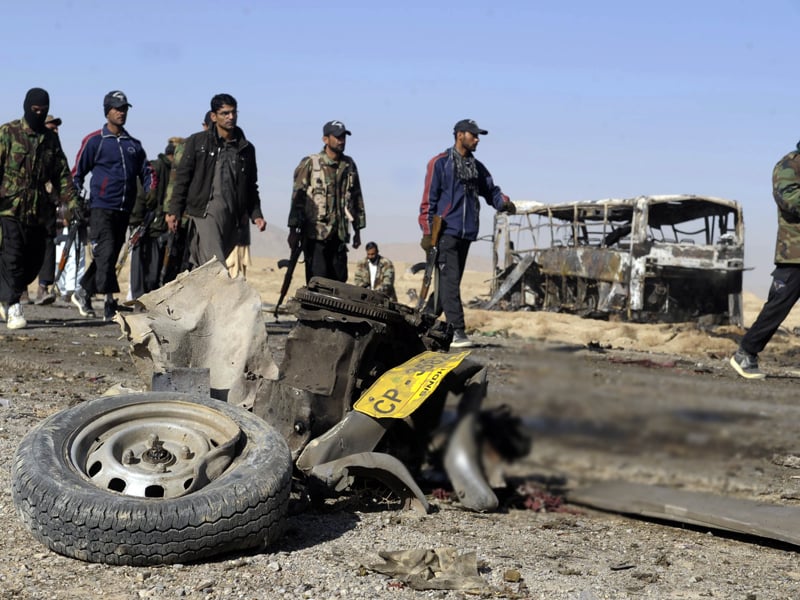 security personnel cordon off the site of a car bomb attack on shia pilgrims buses in mastung on december 30 2012 photo afp