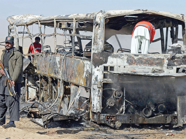 volunteers search for victims in a destroyed pilgrims bus at the site of a car bomb attack in mastung some 30 kilometres south of quetta on sunday photo afp volunteers search for victims in a destroyed pilgrims bus at the site of a car bomb attack in mastung some 30 kilometres south of quetta on sunday photo afp