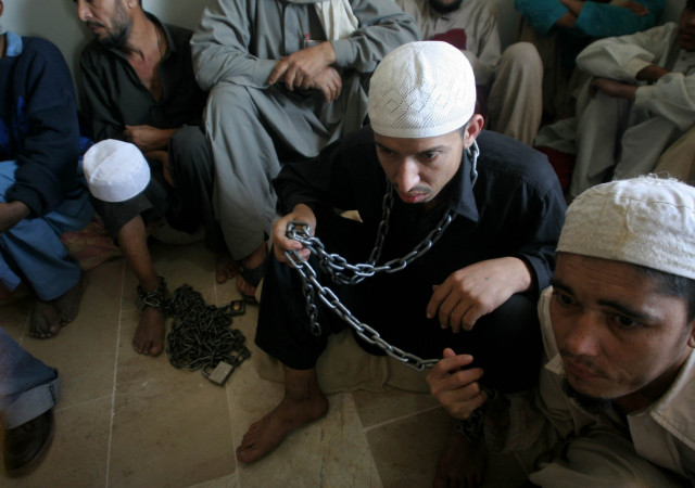 juvenile students of a religious seminary sit chained in police detention photo athar khan express file juvenile students of a religious seminary sit chained in police detention photo athar khan express file