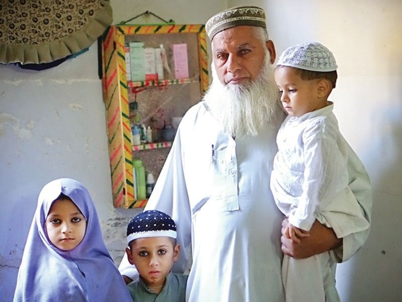gul muhammad khan and his three grandchildren at their home in arafat town three of khan s sons have been killed in separate incidents of sectarian violence and their children now live with him photo credit npr