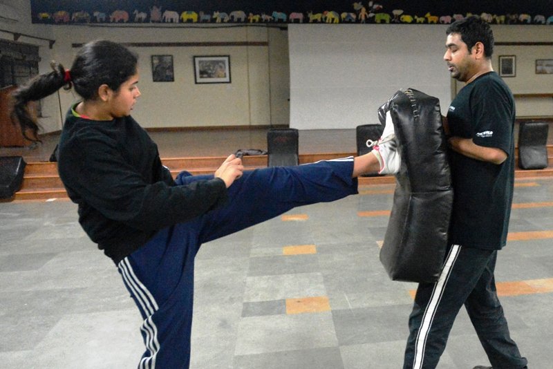 this picture taken on january 2 2013 shows an indian woman l sparring with a trainer during a self defence class in new delhi photo afp