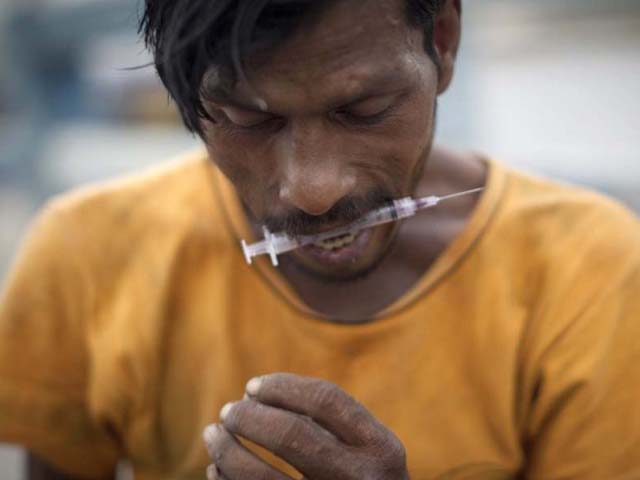 a drug addict prepares to inject himself with drugs pakistan has more than four million drug addicts in its population of 170 million according to figures compiled by the country 039 s anti narcotics force anf photo afp