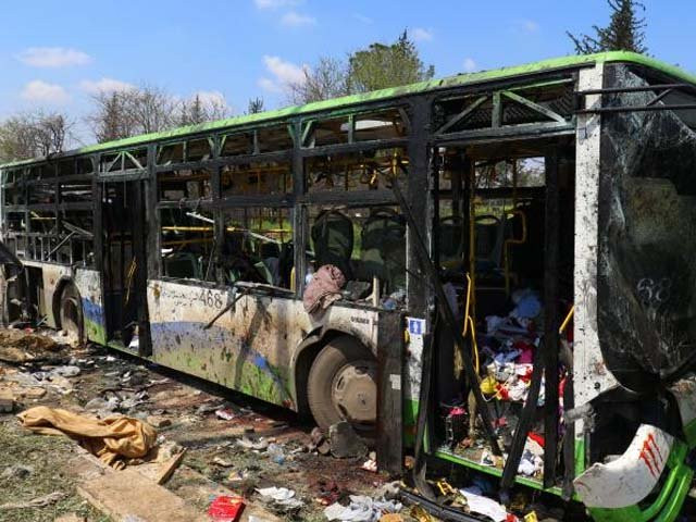 a damaged bus is seen after an explosion yesterday at insurgent held al rashideen aleppo province syria april 16 2017 photo reuters a damaged bus is seen after an explosion yesterday at insurgent held al rashideen aleppo province syria april 16 2017 photo reuters