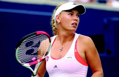 tennis wozniacki through in sydney