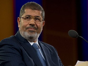 syrian people through their revolution will move to a new stage where they will have an independent parliament morsi photo afp file