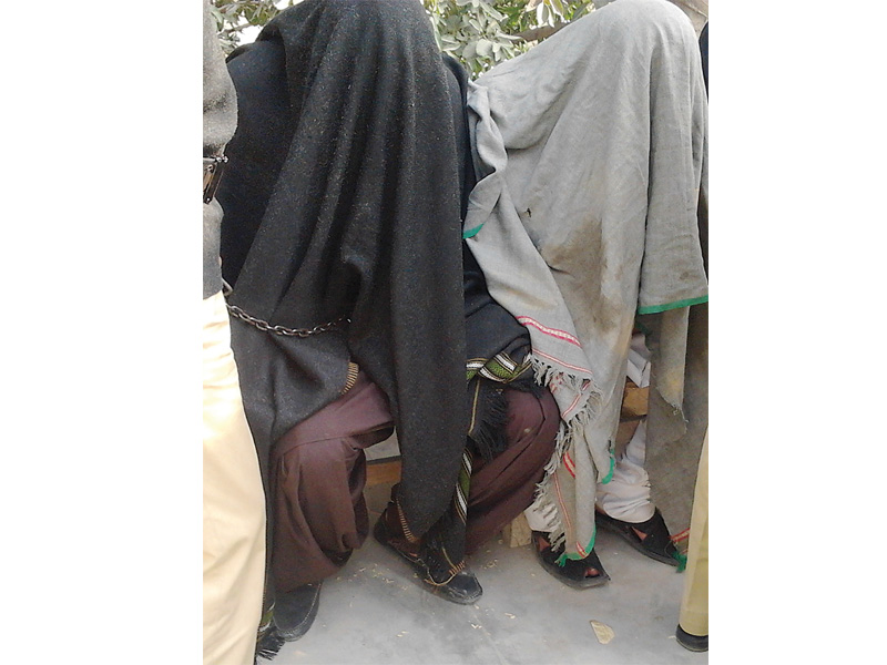 policemen escort one of the prime suspects in the shahzeb khan murder case siraj talpur from the anti terrorism court on monday siraj was arrested on the dadu moro bridge in naushero feroze last saturday the police had also arrested his brother sajjad talpur photo athar khan express