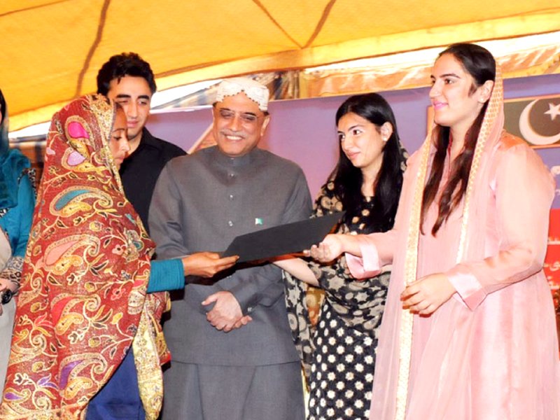 bakhtawar bhutto zardari and aseefa bhutto zardari hand over a certificate to a bisp beneficiary photo online