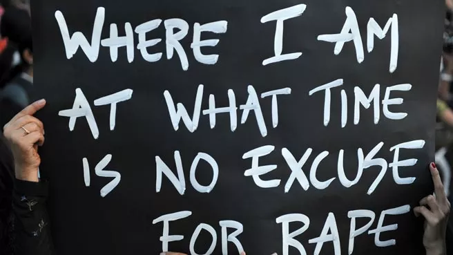 a protester holds a placard to protest the gang rape incident in new delhi photo reuters file a protester holds a placard to protest the gang rape incident in new delhi photo reuters file