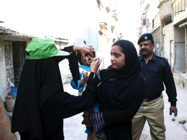this is a file photo of law enforcement accompanying polio workers photo online this is a file photo of law enforcement accompanying polio workers photo online