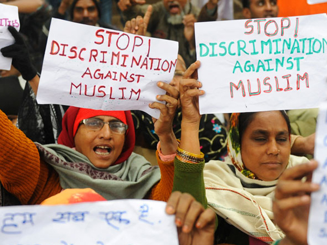 muslim women from indian state of gujarat shout anti government slogans during a protest in new delhi on december 28 2010 against the discrimination exclusion and persecution of muslims photo afp