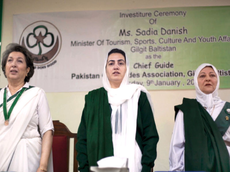 sadia danish stands for the national anthem at a ceremony inducting her as a chief guide for g b for the pakistan girl guides association photo myra iqbal express