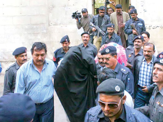 police officials escort other accused at the district and sessions court hearing photo online