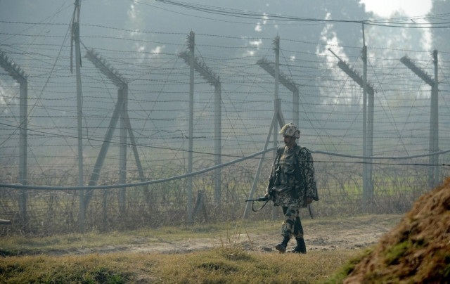 an indian border security force bsf soldier patrols along the border fence at an outpost along the india pakistan border in suchit garh 36 kms southwest of jammu on january 10 2013 photo afp an indian border security force bsf soldier patrols along the border fence at an outpost along the india pakistan border in suchit garh 36 kms southwest of jammu on january 10 2013 photo afp