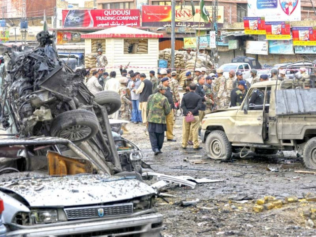 security personnel examine the site of a bomb explosion in quetta photo afp security personnel examine the site of a bomb explosion in quetta photo afp