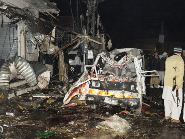 Pakistani security officials examine the site of a bomb attack in Quetta on January 10, 2013. PHOTO: AGENCIES