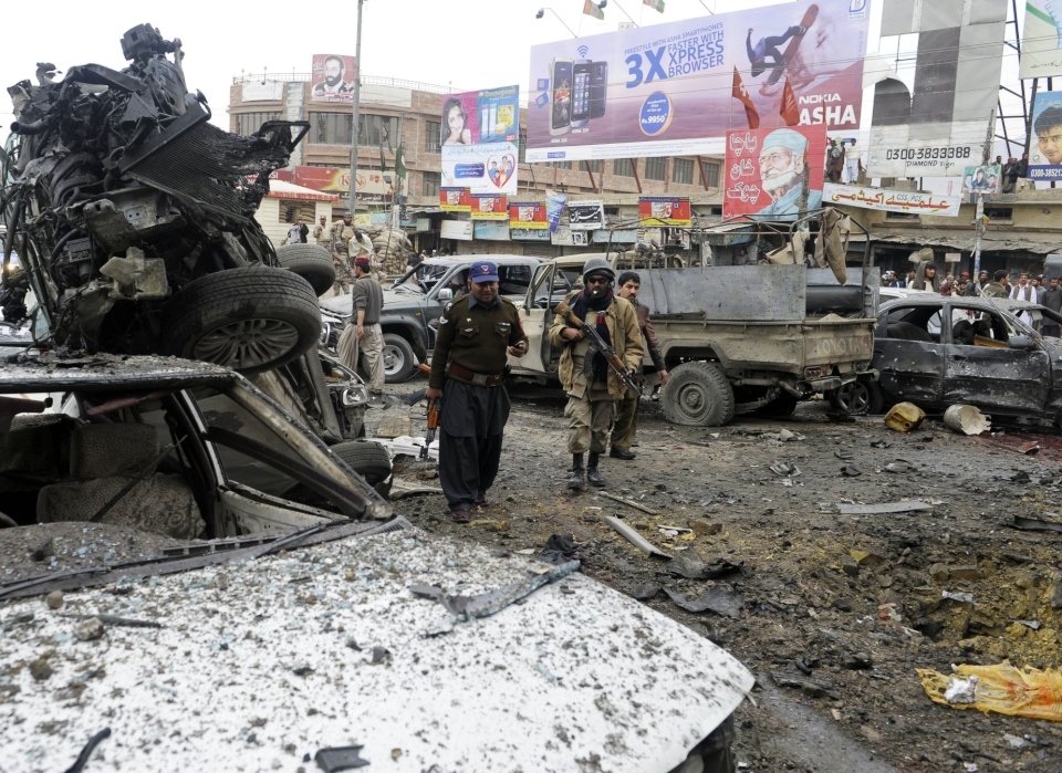 security personnel examine the site of a bomb explosion in quetta photo afp