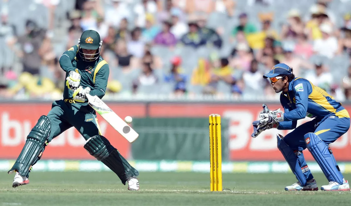 australian batsman phillip hughes l plays a shot on his way to a century as sri lankan wicketkeeper dinesh chandimal r looks on photo afp australian batsman phillip hughes l plays a shot on his way to a century as sri lankan wicketkeeper dinesh chandimal r looks on photo afp