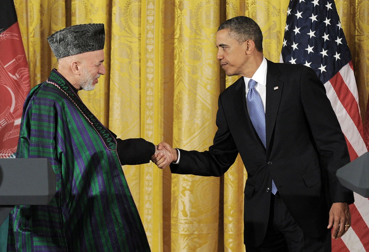 us president barack obama r shakes hands with his afghan counterpart hamid karzai in the white house washington dc on january 11 2013 photo afp