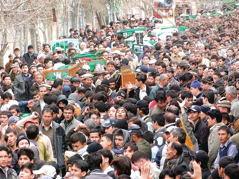 mourners grieve over the death of victims of the twin blasts in quetta photo inp