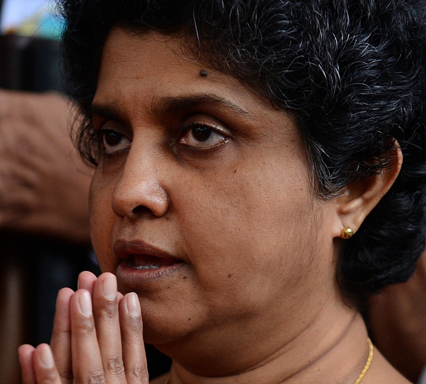 in this photograph taken on december 4 2012 sri lanka s chief justice shirani bandaranayake prays outside the supreme court in colombo photo afp