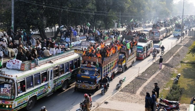 supporters of tahirul qadri take part in a protest march in lahore photo afp