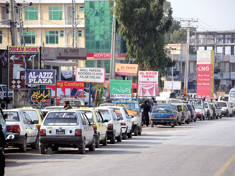 a long que of vehicles outside a cng filling station in rawalpindi photo waseem nazir express