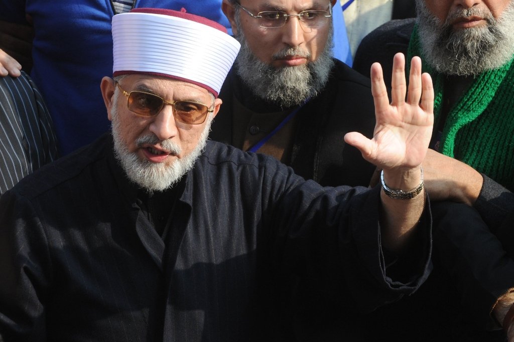 tahirul qadri talks with media representatives before the start of protest march in lahore on january 13 2013 photo afp