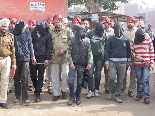 the accused are escorted by police to a court at gurdaspur photo reuters the accused are escorted by police to a court at gurdaspur photo reuters