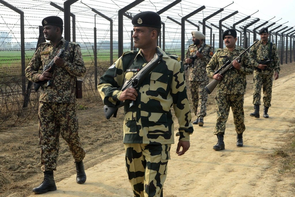 indian border security force soldiers patrol along the india pakistan border fence about 27 km from wagah on january 13 2013 photo afp