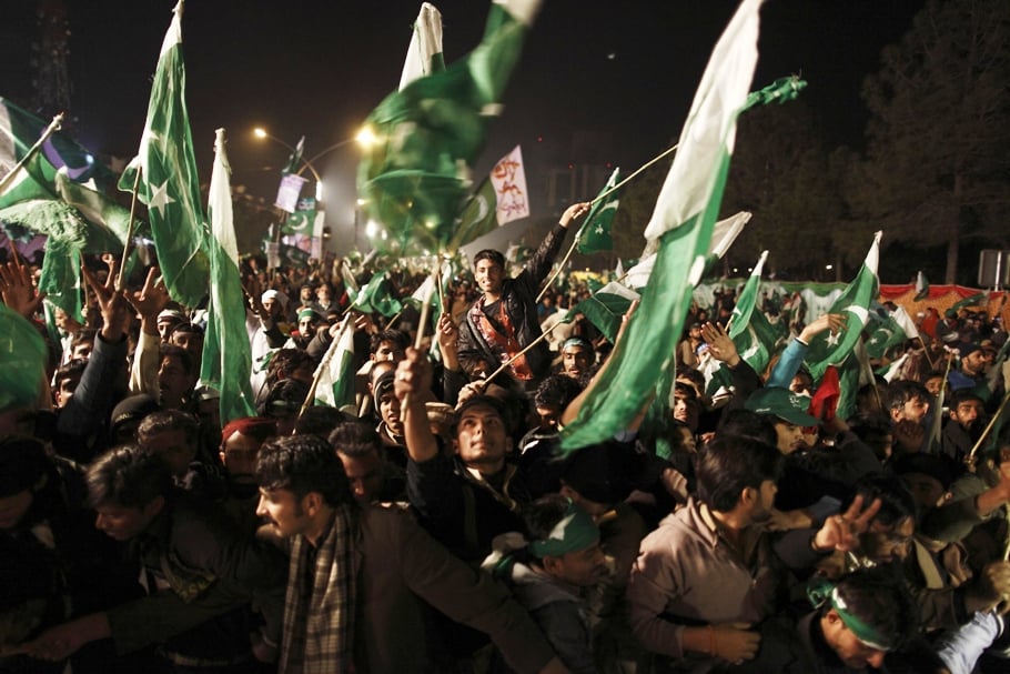 supporters of tahirul qadri wave pakistani flags during a protest in islamabad photo reuters