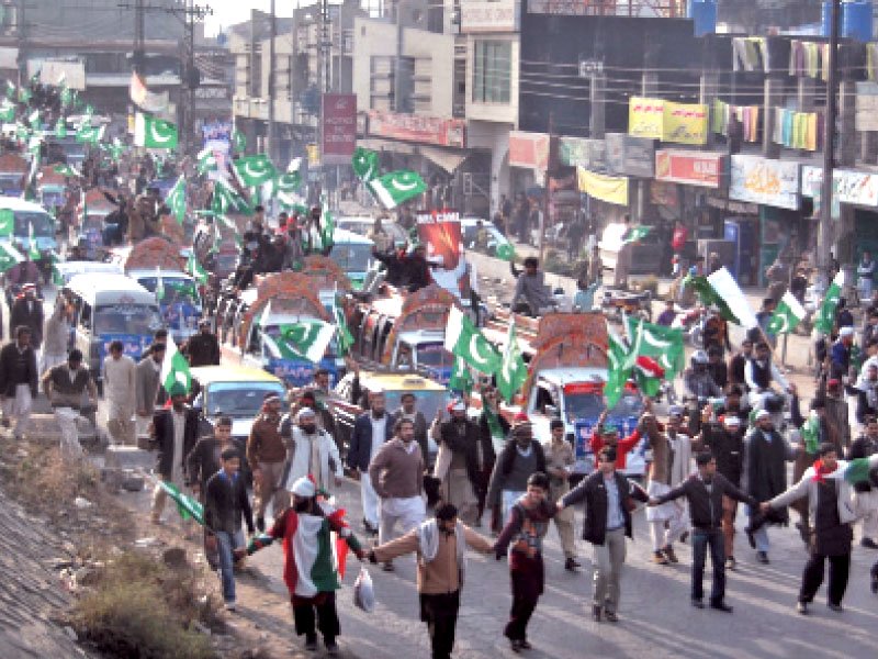 a rally in faizabad marches towards blue area top access to the d chowk was blocked early in the day due to it being the proposed rally site photo muhammad javaid express