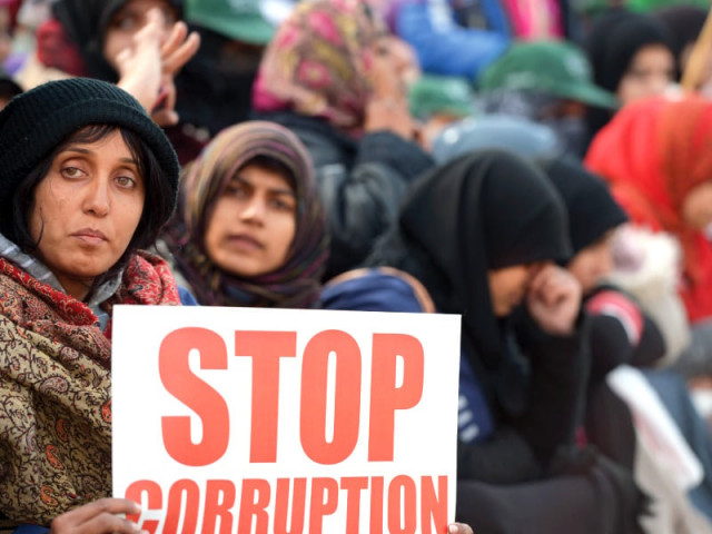 women supporters of dr tahirul qadri hold placards during the protest march in islamabad photo afp women supporters of dr tahirul qadri hold placards during the protest march in islamabad photo afp