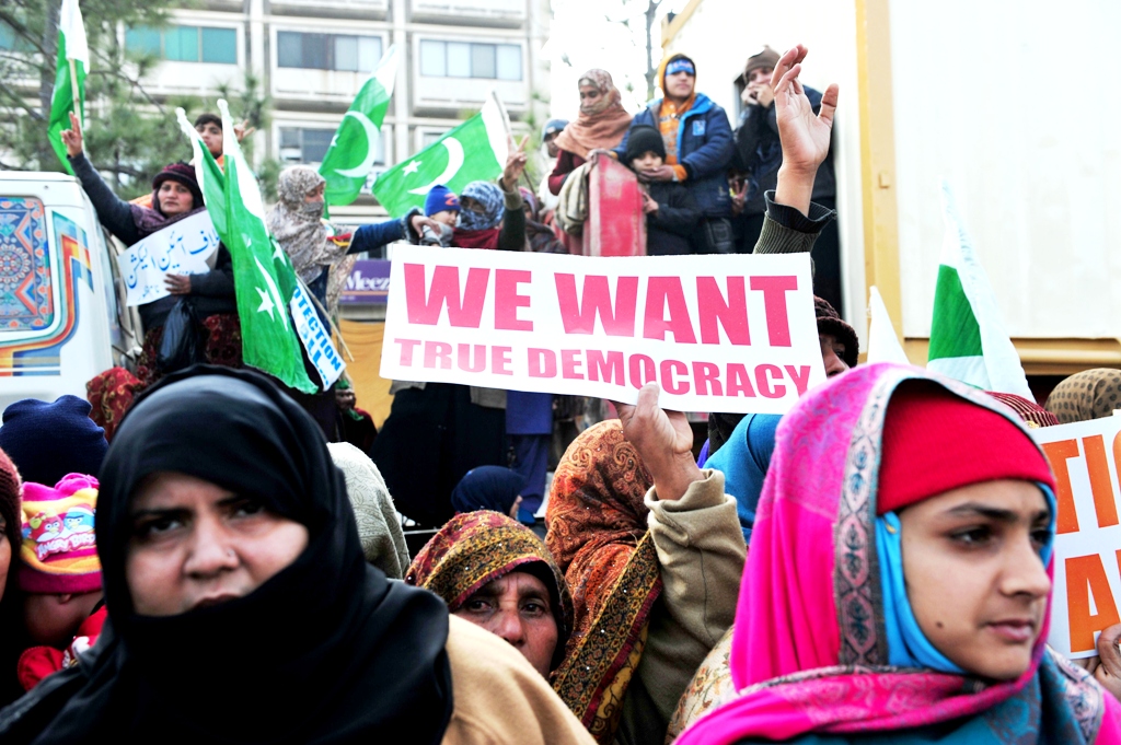this file photo shows supporters of tahirul qadri look on during a sit in in islamabad on january 15 2013 photo afp