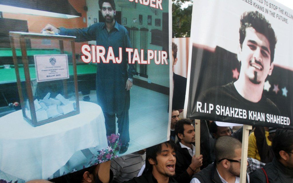 this file photo shows protestors in karachi hold pictures of shahzeb khan and suspect siraj talpur photo athar khan the express tribune