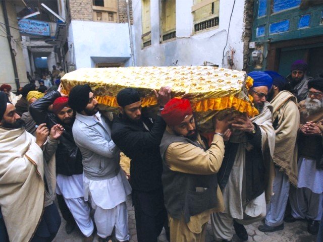 pallbearers carry mahinder singh s coffin who was the father of six he was kidnapped two months ago photo iqbal mamound express