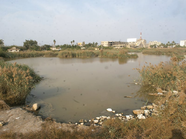the lake inside aziz bhatti park once renovated will be the largest artificial lake in the city photo athar khan express the lake inside aziz bhatti park once renovated will be the largest artificial lake in the city photo athar khan express