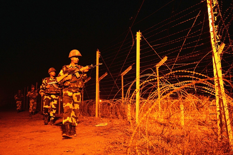 indian border security force soldiers patrol along the border fence at an outpost along the india pakistan border in abdulian photo afp