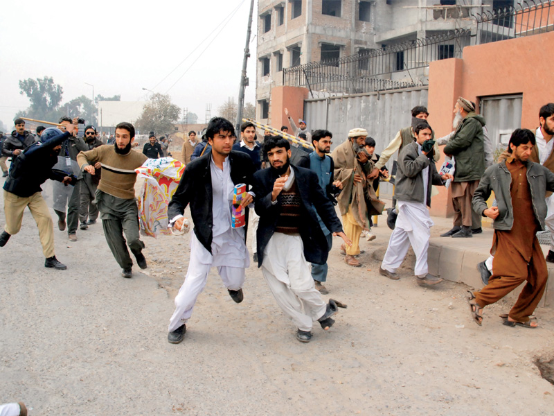 police resorts to force to scatter demonstrators outside the peshawar press club photo ghaffar baig express