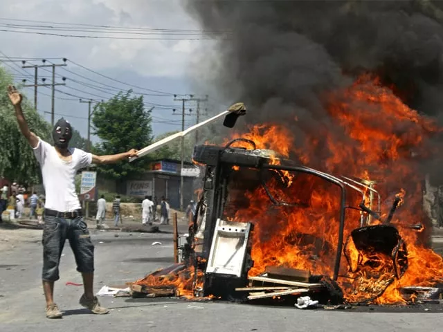 a masked kashmiri shouts anti indian slogans beside a burning police vehicle in pampore on sunday photo afp a masked kashmiri shouts anti indian slogans beside a burning police vehicle in pampore on sunday photo afp