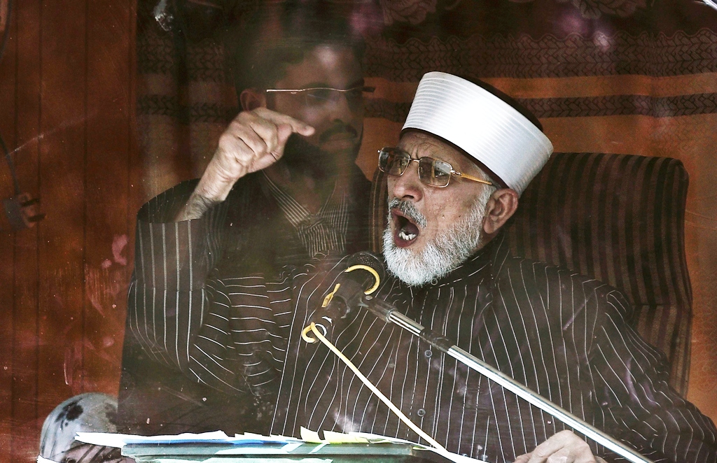file photo of leader of minhaj ul quran international tahirul qadri addressing his supporters from behind the window of an armoured vehicle on the second day of protests in islamabad january 15 2013 photo reuters