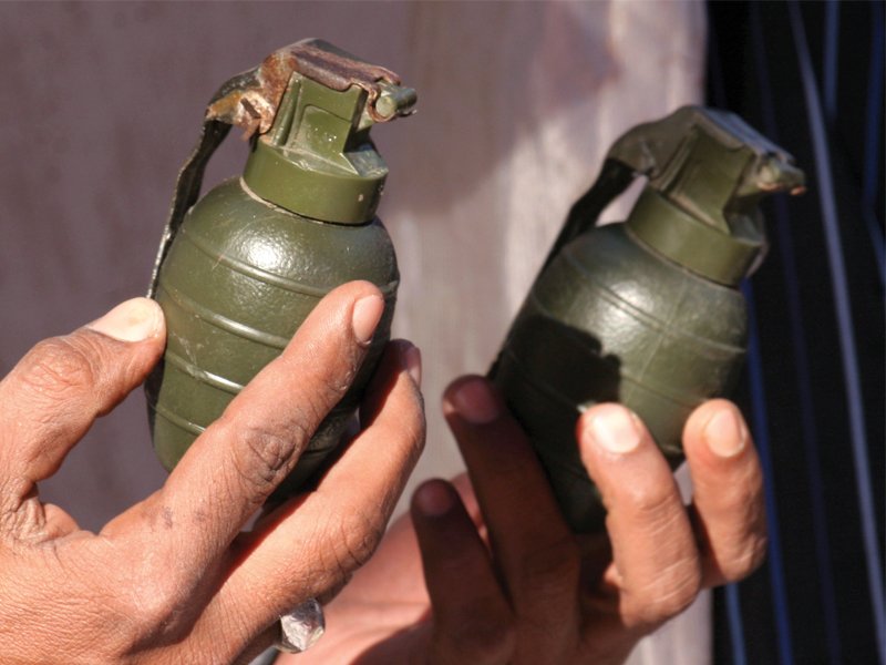 police seized four hand grenades and other weapons from the suspects after engaging them in an encounter in bilal colony in korangi on friday the suspects had created their own shadow militant group and used to extort money from traders in the area photo athar khan express